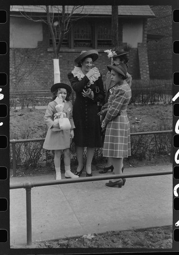 Group of people talking in front of church, South Side of Chicago, Illinois