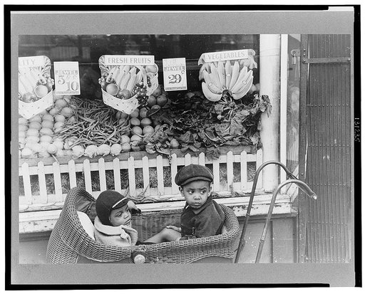 Children in front of grocery store, Chicago, Illinois