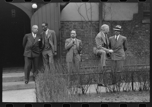 Men outside an Episcopal Church, on Sunday morning, South Side of Chicago, Illinois