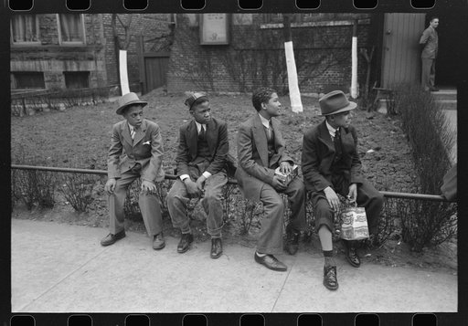 Boys waiting outside of Episcopal Church to see the processional, South Side of Chicago, Illinois
