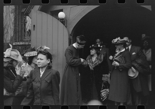 Untitled photo, possibly related to: Shaking hands with members of the congregation after services at an Episcopal Church, South Side, Chicago, Illinois