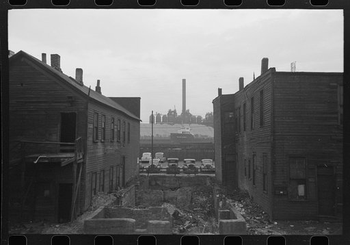 Untitled photo, possibly related to: Condemned houses in Negro section of Chicago, Illinois, with steel mills in background
