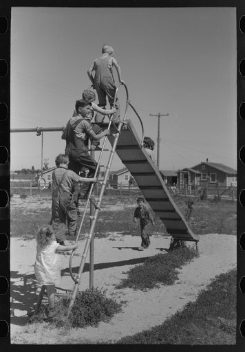 Children playing on slide at FSA (Farm Security Administration) labor camp, Caldwell, Idaho