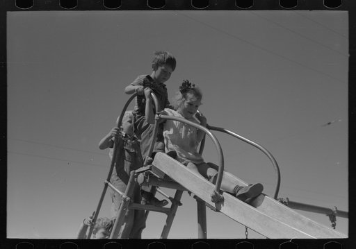 Untitled photo, possibly related to: Children playing on slide at FSA (Farm Security Administration) labor camp, Caldwell, Idaho