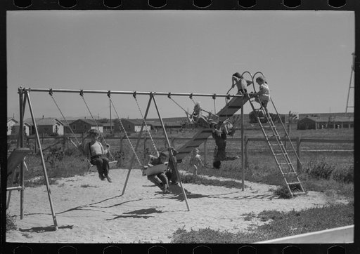 Untitled photo, possibly related to: Children playing on slide at FSA (Farm Security Administration) labor camp, Caldwell, Idaho