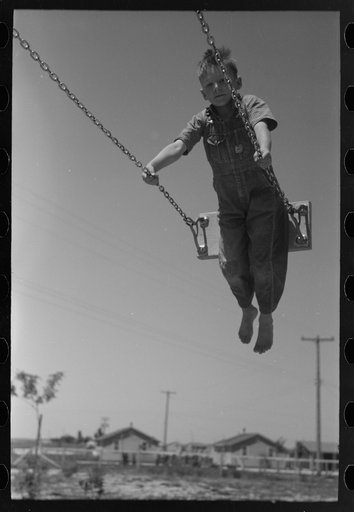 Untitled photo, possibly related to: Children playing on slide at FSA (Farm Security Administration) labor camp, Caldwell, Idaho