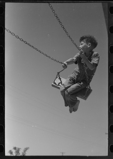 Untitled photo, possibly related to: Children playing on slide at FSA (Farm Security Administration) labor camp, Caldwell, Idaho