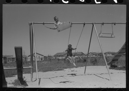 Untitled photo, possibly related to: Children playing on slide at FSA (Farm Security Administration) labor camp, Caldwell, Idaho