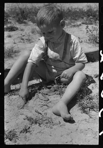 Untitled photo, possibly related to: Son of the farm worker at the FSA (Farm Security Administration) labor camp. Caldwell, Idaho