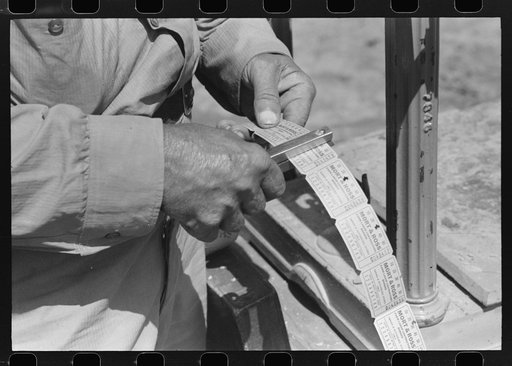 Untitled photo, possibly related to: When you deliver a hamper of peas to the checker he gives you this check redeemable once a week. Labor contractor's pea pickers crew.  Nampa, Idaho.