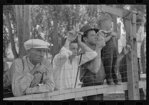 Spectators watch the baseball game on the Fourth of July at Vale, Oregon