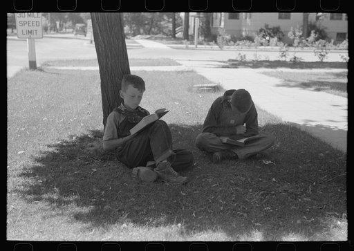 Untitled photo, possibly related to: Boys read storybooks in the shade. Caldwell, Idaho