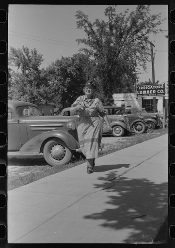Untitled photo, possibly related to: She has been shopping and bought a flag for the Fourth of July. Caldwell, Idaho