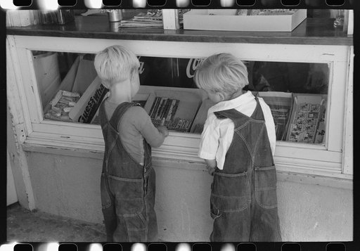 Little boys deciding what kind of candy they want to buy. Caldwell, Idaho