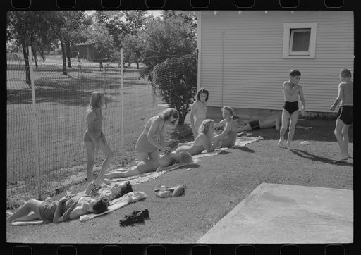 Sun bathers at the swimming pool. Caldwell, Idaho