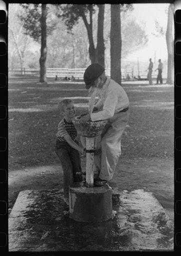 Fun at the water fountain, picnic grounds, Vale, Oregon