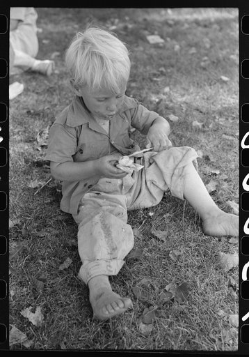 Little boy enjoys his ice cream, Fourth of July, Vale, Oregon
