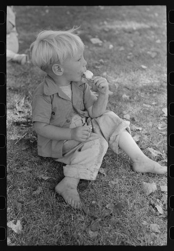 Little boy enjoys his ice cream, Fourth of July, Vale, Oregon