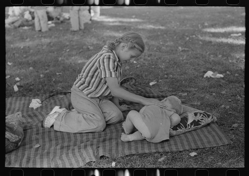 Even at a Fourth of July picnic baby brother must have his nap, Vale, Oregon
