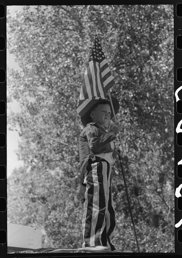 Boy on float in Fourth of July parade. Vale, Oregon