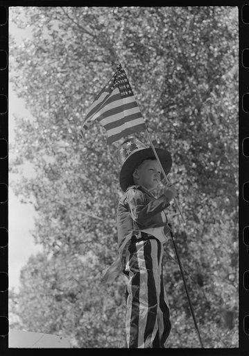 Untitled photo, possibly related to: Boy on float in Fourth of July parade. Vale, Oregon