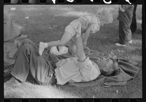 Untitled photo, possibly related to: Farmer with his granddaughter at picnic on Fourth of July. Vale, Oregon