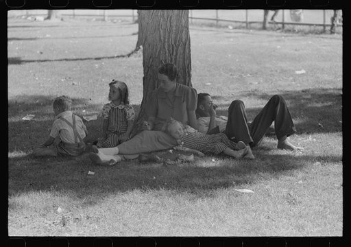 Untitled photo, possibly related to: Farmer with his granddaughter at picnic on Fourth of July. Vale, Oregon