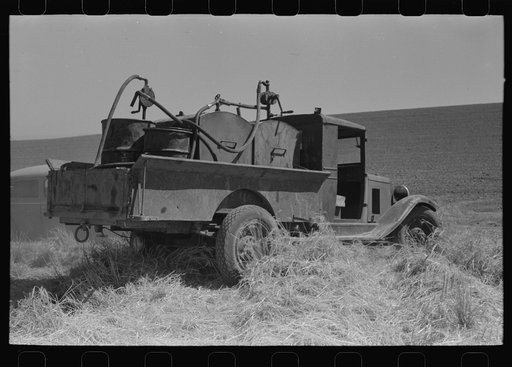 Gasoline, fuel oil and lubricants are carried to tractor and combine in wheat field. Eureka Flats, Walla Walla County, Washington