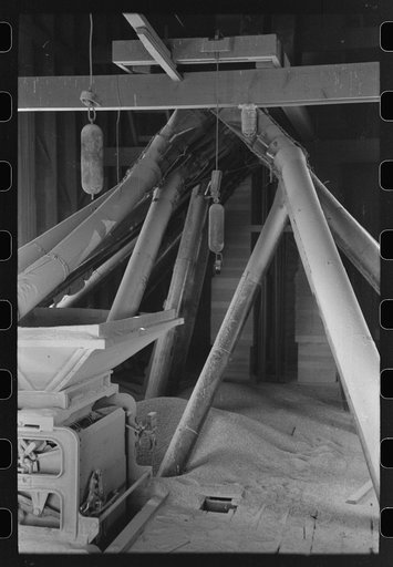 Untitled photo, possibly related to: Directing bulk wheat after combine has been through. Eureka Flats, Walla Walla County, Washington