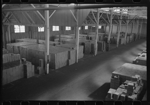 Untitled photo, possibly related to: Cases of canned salmon in warehouse, Astoria, Oregon