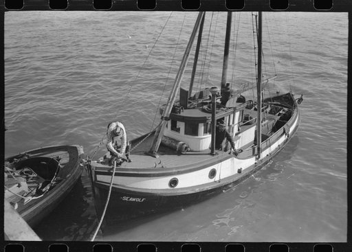 Fishing boat tied up at docks of the Columbia River Packing Association, Astoria, Oregon