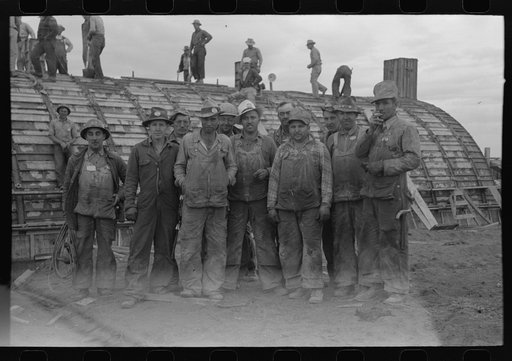 Workmen at Umatilla Ordnance Depot in front of igloo under construction, Hermiston, Oregon
