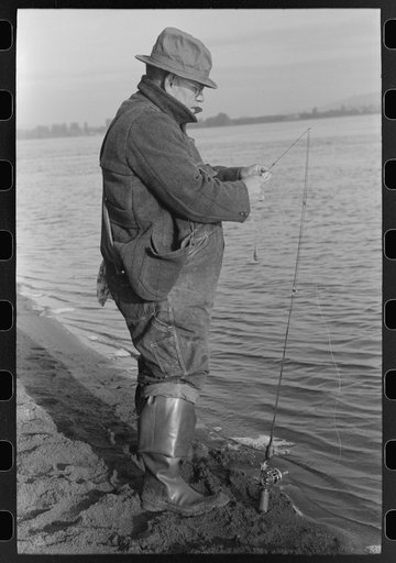 Fisherman on banks of Columbia River, Cowlitz County, Washington
