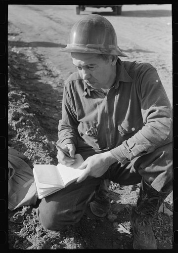 Workman in the surveying crew at Shasta Dam, Shasta County, California
