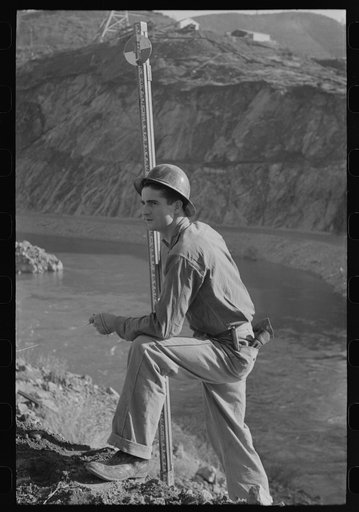Workman in the surveying crew at Shasta Dam, Shasta County, California