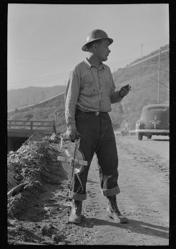 Chain man of surveying crew at Shasta Dam, Shasta County, California