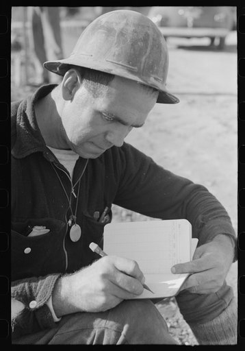 Workman in surveying crew at Shasta Dam, Shasta County, California