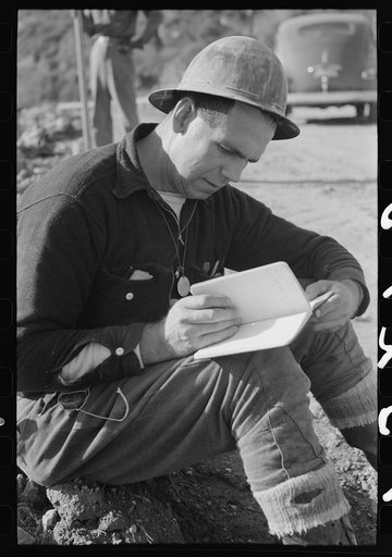 Workman in surveying crew at Shasta Dam, Shasta County, California