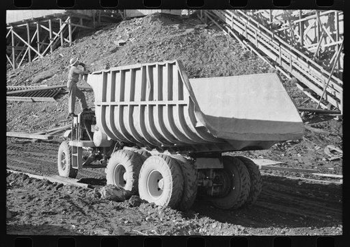Dump truck which carries materials for use in construction of Shasta Dam, Shasta County, California. This truck uses butane instead of gasoline because of the extra power butane gives