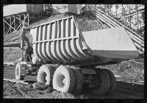 Dump truck which carries materials for use in construction of Shasta Dam, Shasta County, California. This truck uses butane instead of gasoline because of the extra power butane gives