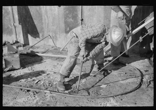 Workman at Shasta Dam, Shasta County, California
