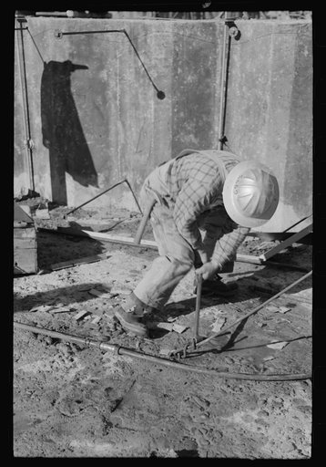 Workman at Shasta Dam, Shasta County, California