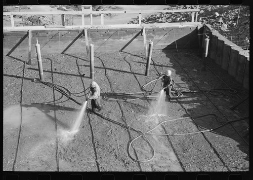 Untitled photo, possibly related to: Wetting down freshly-poured concrete, Shasta Dam, Shasta County, California