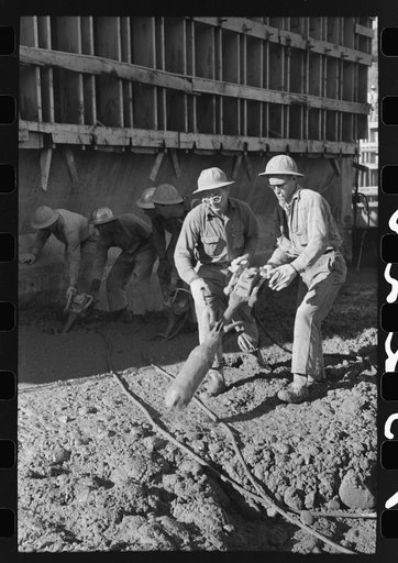 Operating viberators which spread concrete, Shasta Dam, Shasta County, California