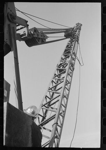 Untitled photo, possibly related to: Crane on top of central tower for handling repairs of carriage of buckets which deliver material to construction points at Shasta Dam, Shasta County, California
