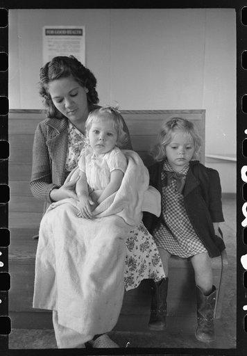 Agricultural workers wait in the clinic at the FSA (Farm Security Administration) farm workers community, Woodville, California