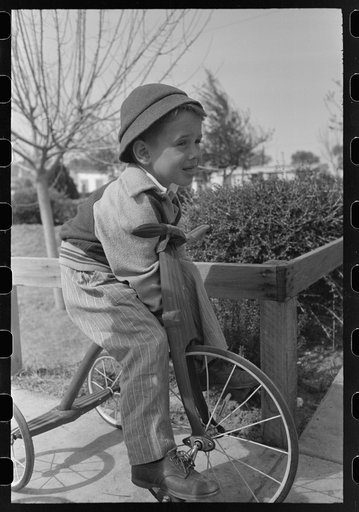 Little boy at the FSA (Farm Security Administration) Camelback Farms, Phoenix, Arizona