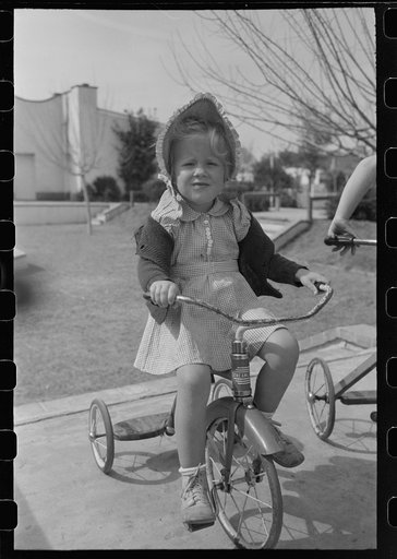 Untitled photo, possibly related to: Little girl at the FSA (Farm Security Administration) Camelback Farms, Phoenix, Arizona
