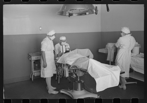 Giving the anesthetic for operation at the Cairns General Hospital at the FSA (Farm Security Administration) farmworkers community, Eleven Mile Corner, Arizona