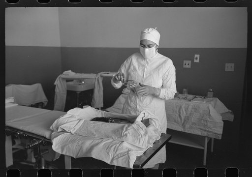 Sterile nurse lays out instruments for operation at the Cairns General Hospital at the FSA (Farm Security Administration) farmworkers community, Eleven Mile Corner, Arizona